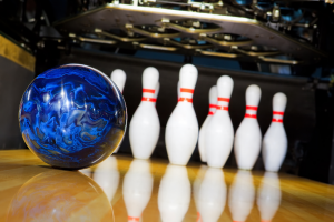 Bowling ball rolling toward the pins